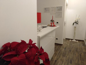 Отель DomuS al Corso B&B  Каноса-Ди-Пулья